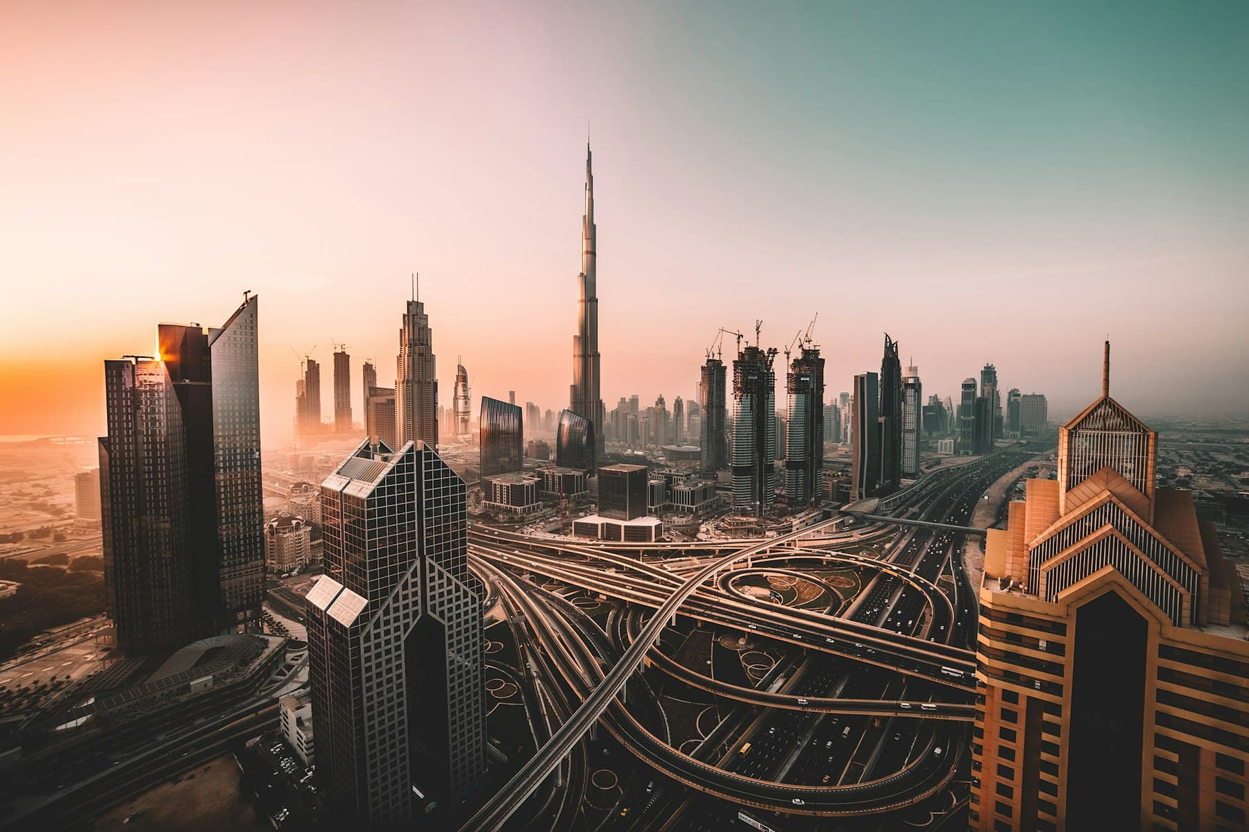 Downtown Dubai and the Burj Khalifa at dusk, seen across the city